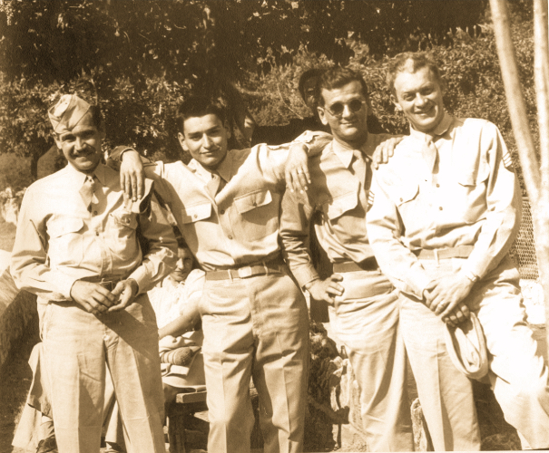 Goofing around with his Army buddies outside.