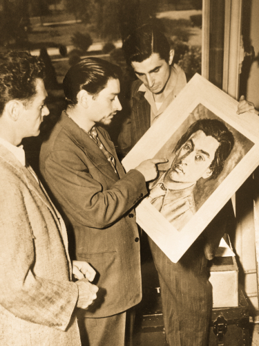 Richard showing his art to friends.