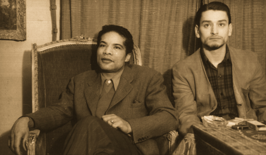 Richard and Herbert Gentry watching a fashion show in Paris.