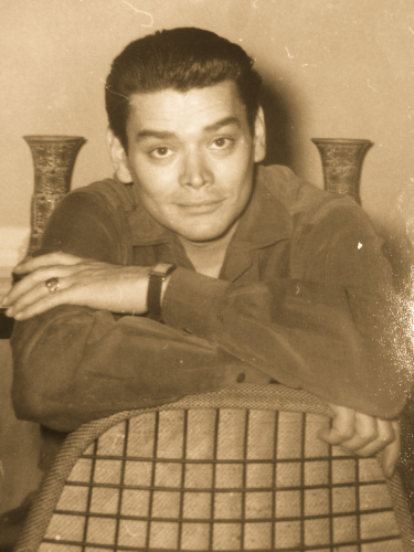 Sitting in an Eames Eiffel chair.